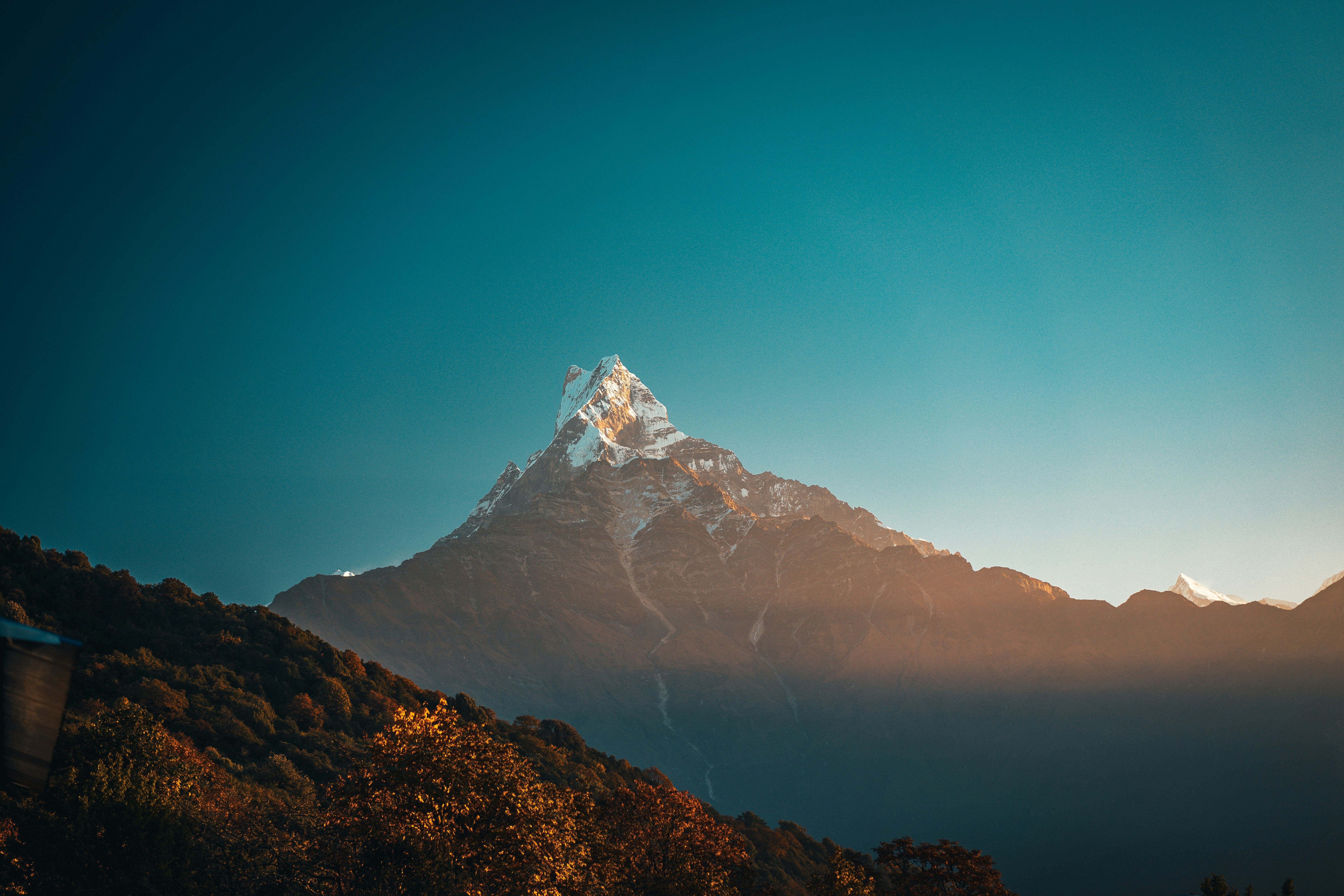 brown and white mountain under blue sky during daytime